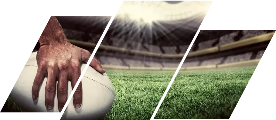 Close-up of rugby player holding ball on the rugby pitch