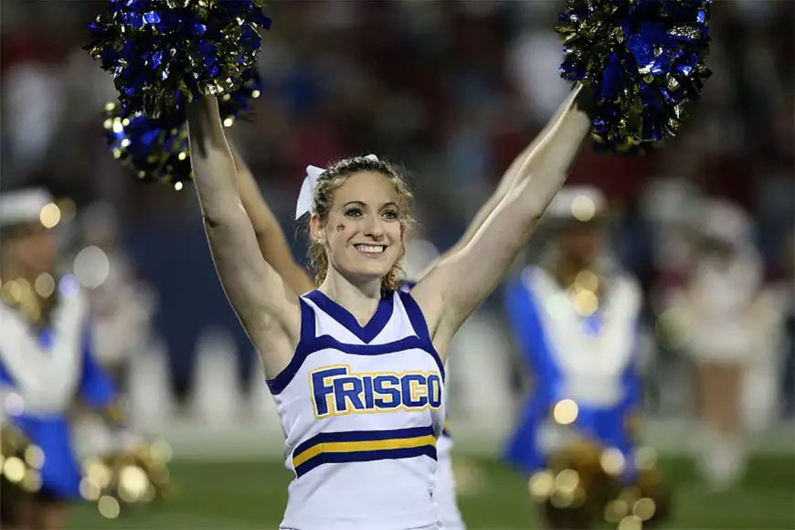 Cheer leader shaking pom poms